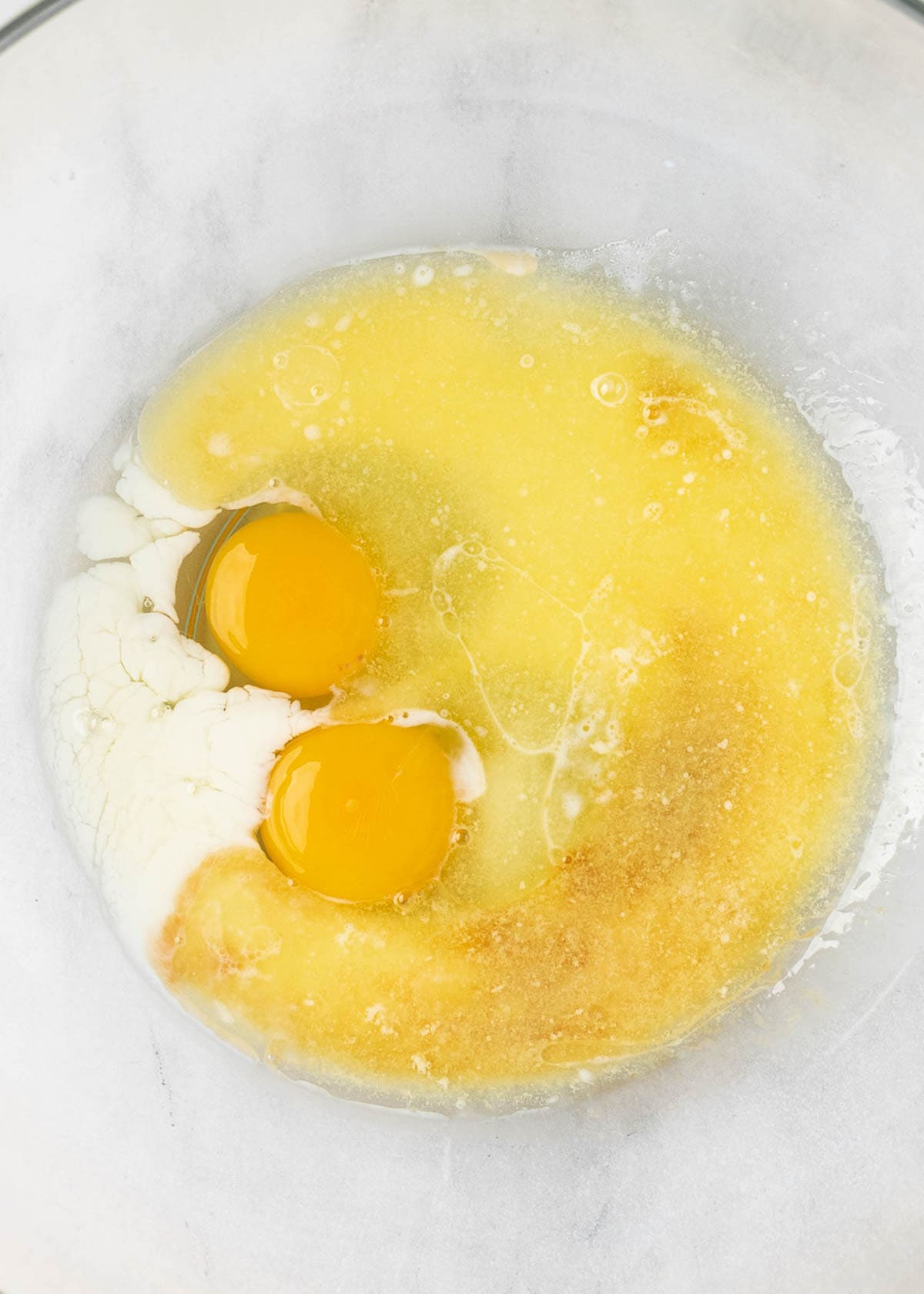 wet pancake ingredients in a clear mixing bowl