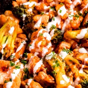 close up image of buffalo chicken skillet in a cast iron skillet