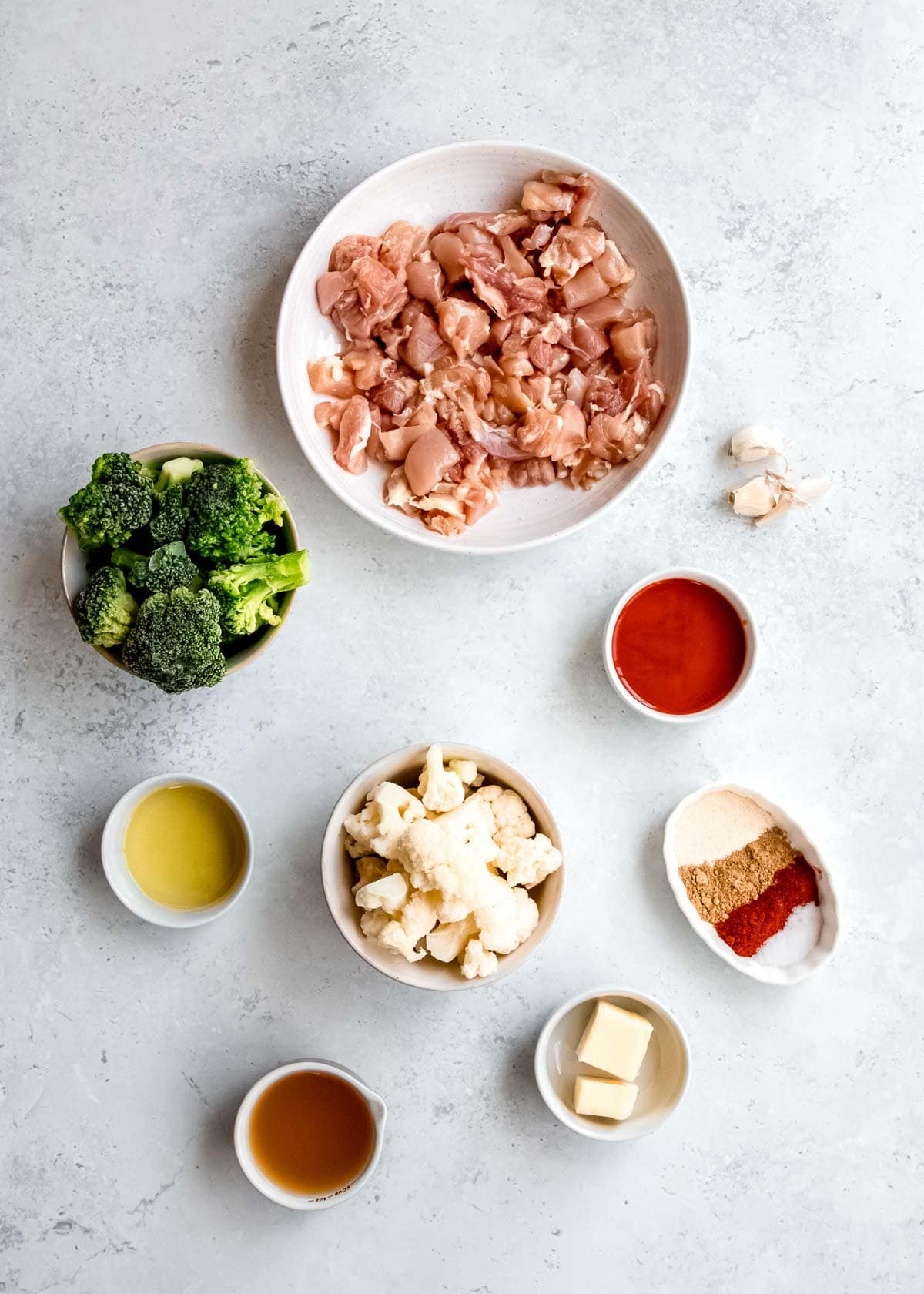 overhead image of buffalo chicken skillet ingredients on a white table