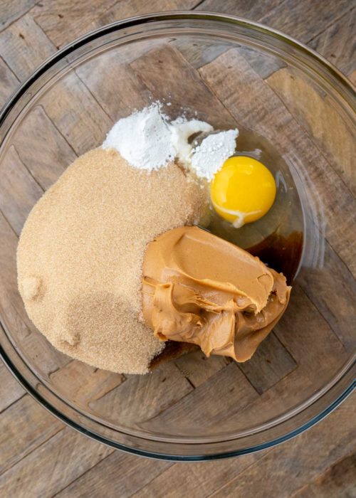 peanut butter, brown sugar monk fruit, egg, baking soda, and vanilla extract in a glass bowl