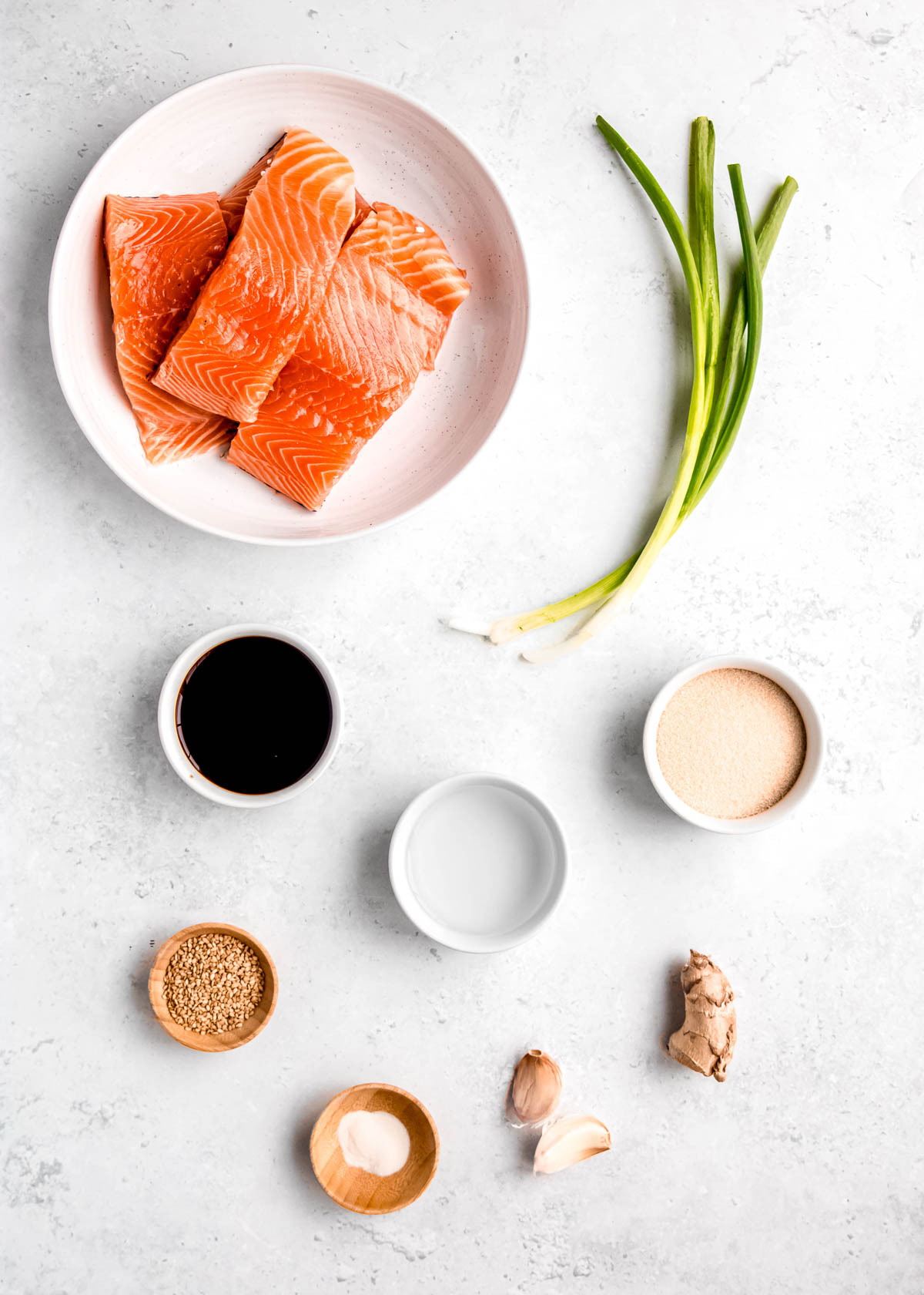 overhead image of teriyaki salmon ingredients on white table