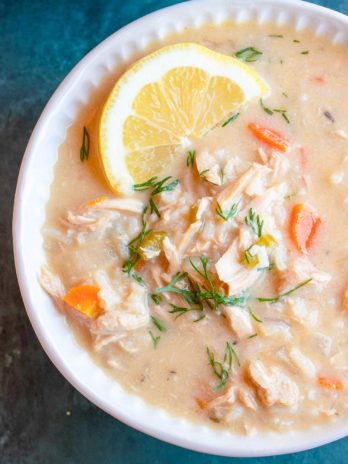 close up, overhead image of avgolemono soup in white bowl