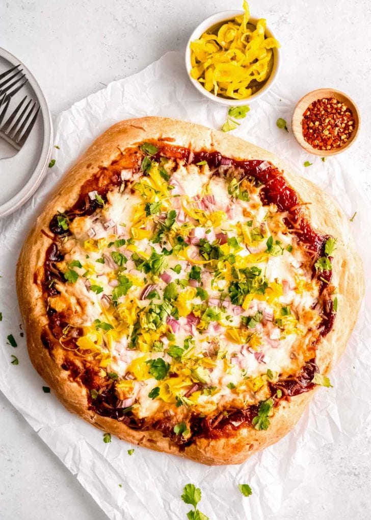 cooked bbq chicken pizza on white table