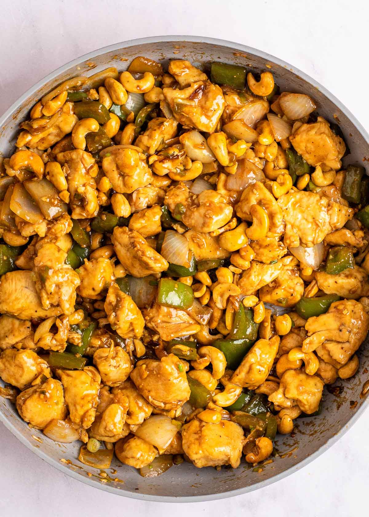 cashew chicken after being stirred in a skillet