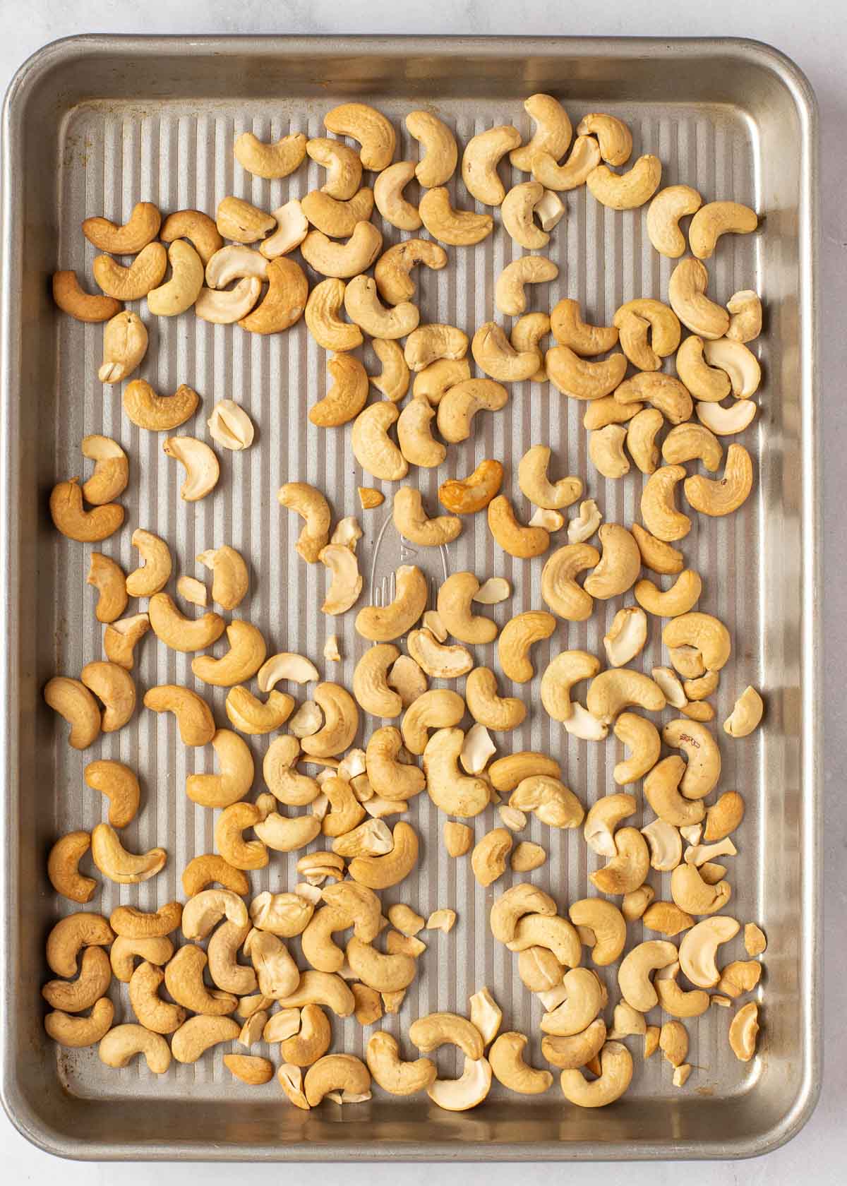 roasted cashews on a sheet pan