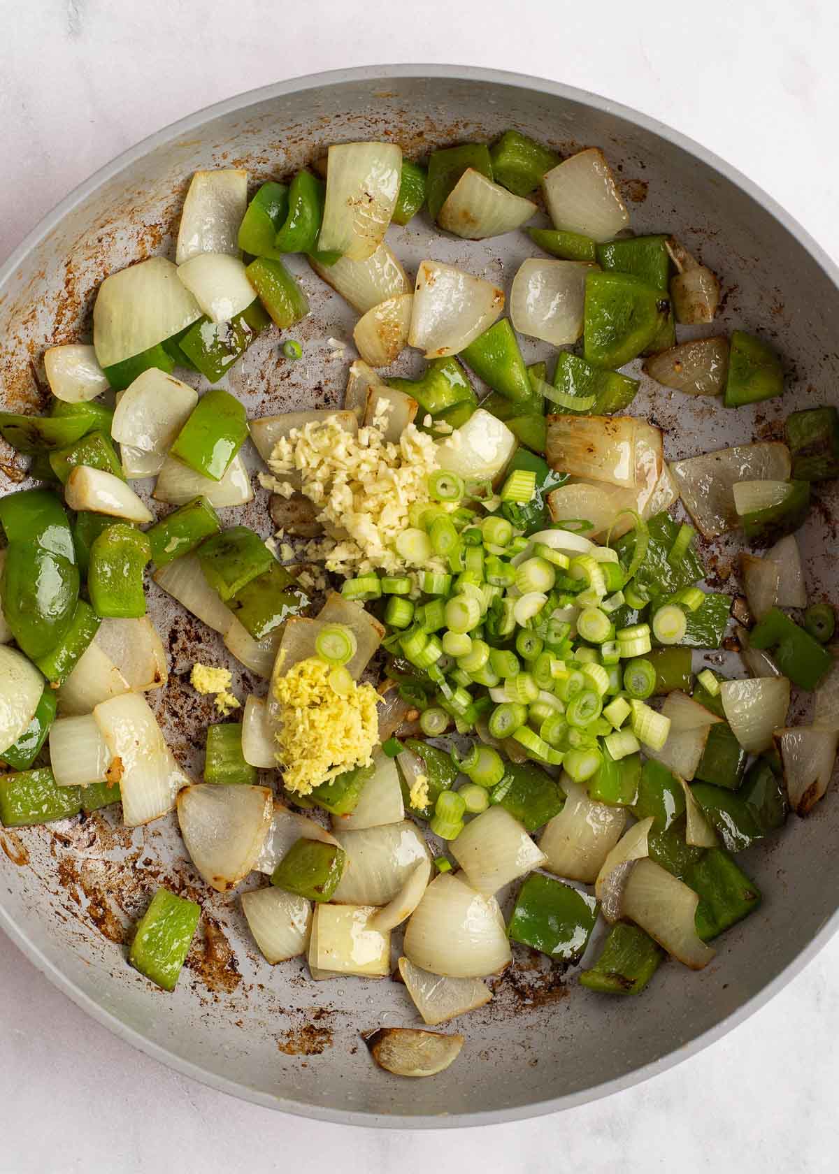 sauteed bell pepper and onion in a skillet