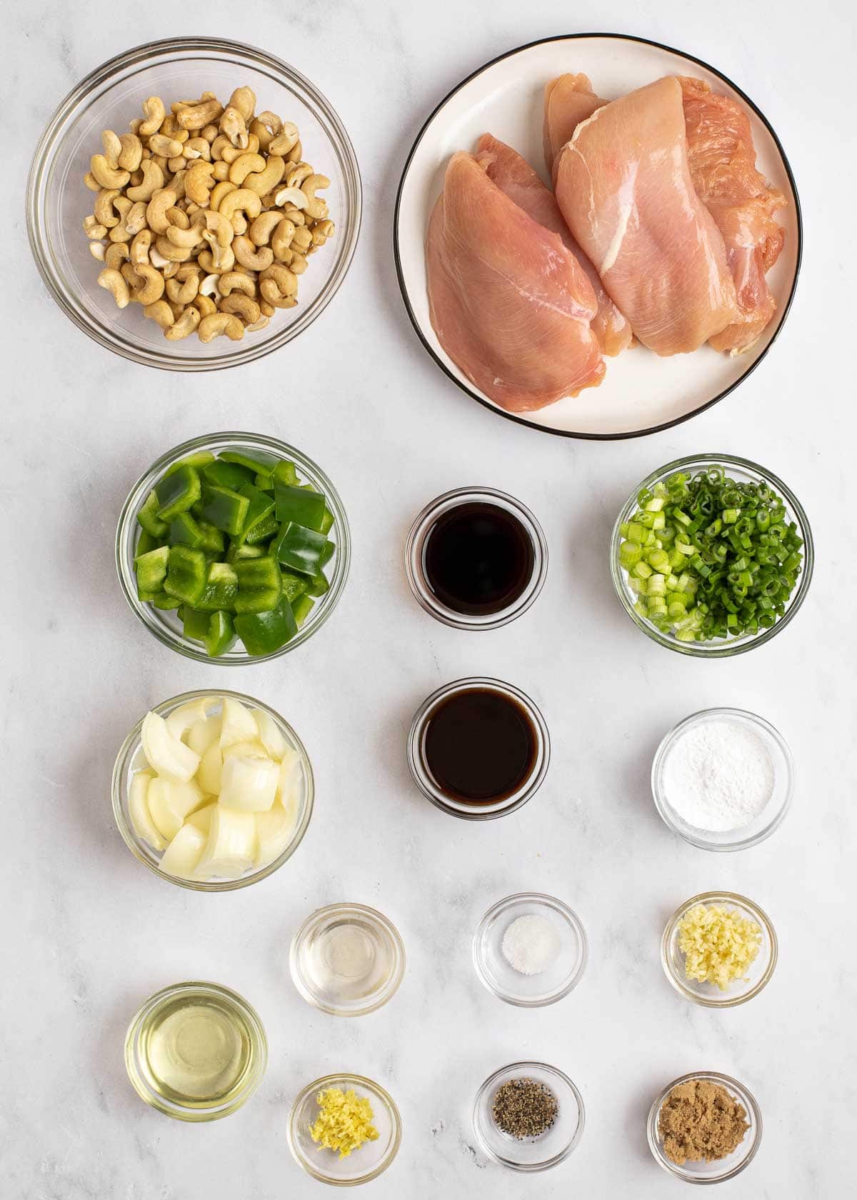 cashew chicken ingredients on a white table 