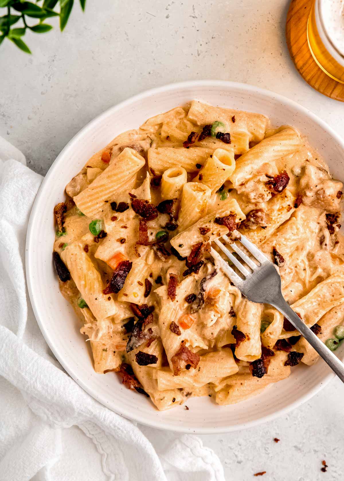 creamy chicken bacon ranch pasta on a white plate