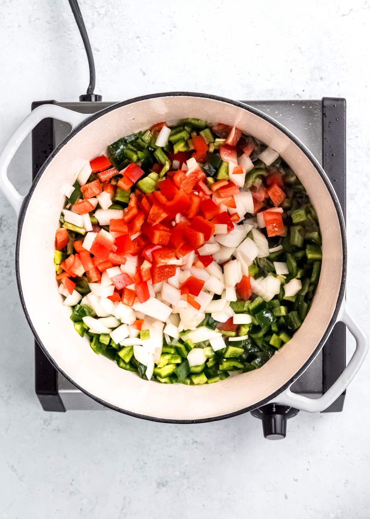 vegetables being sauteed in dutch oven