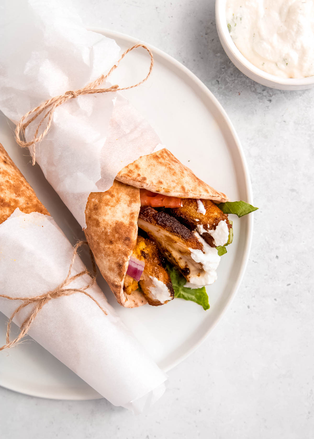 overhead image of chicken shawarma on white plate 