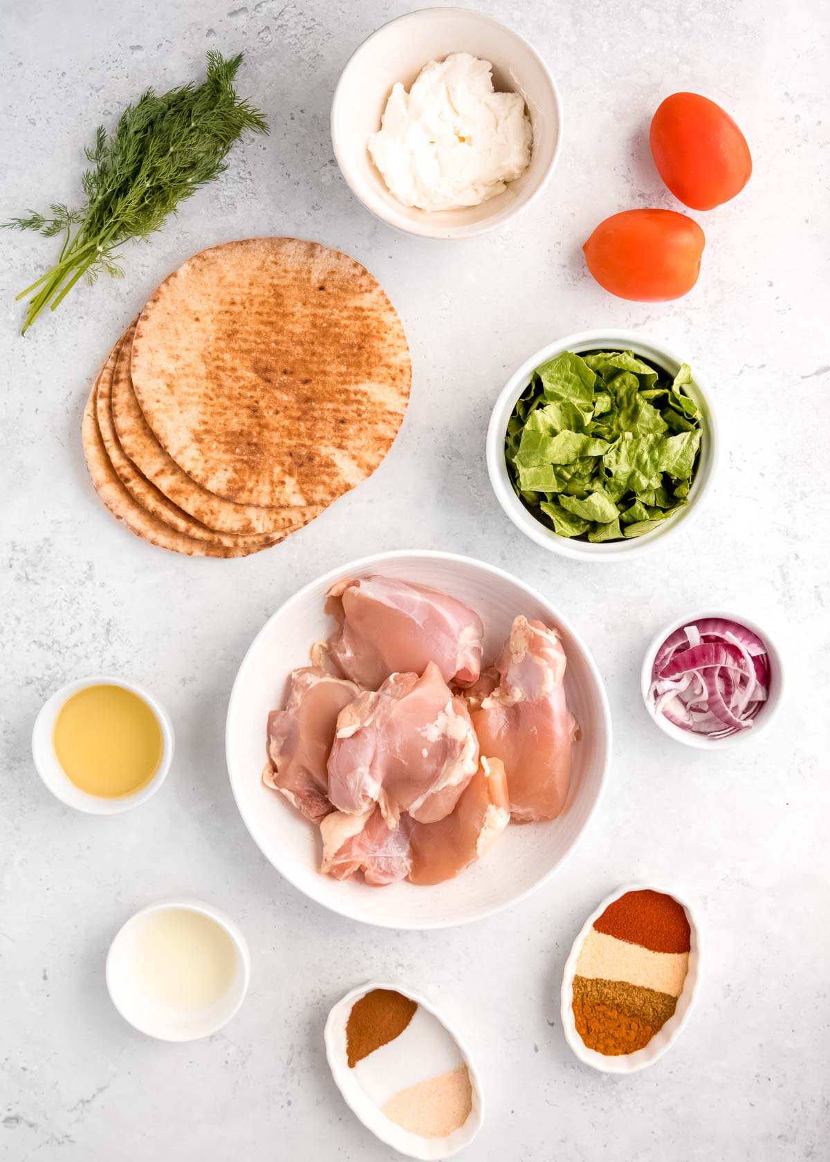 chicken shawarma ingredients on a white table