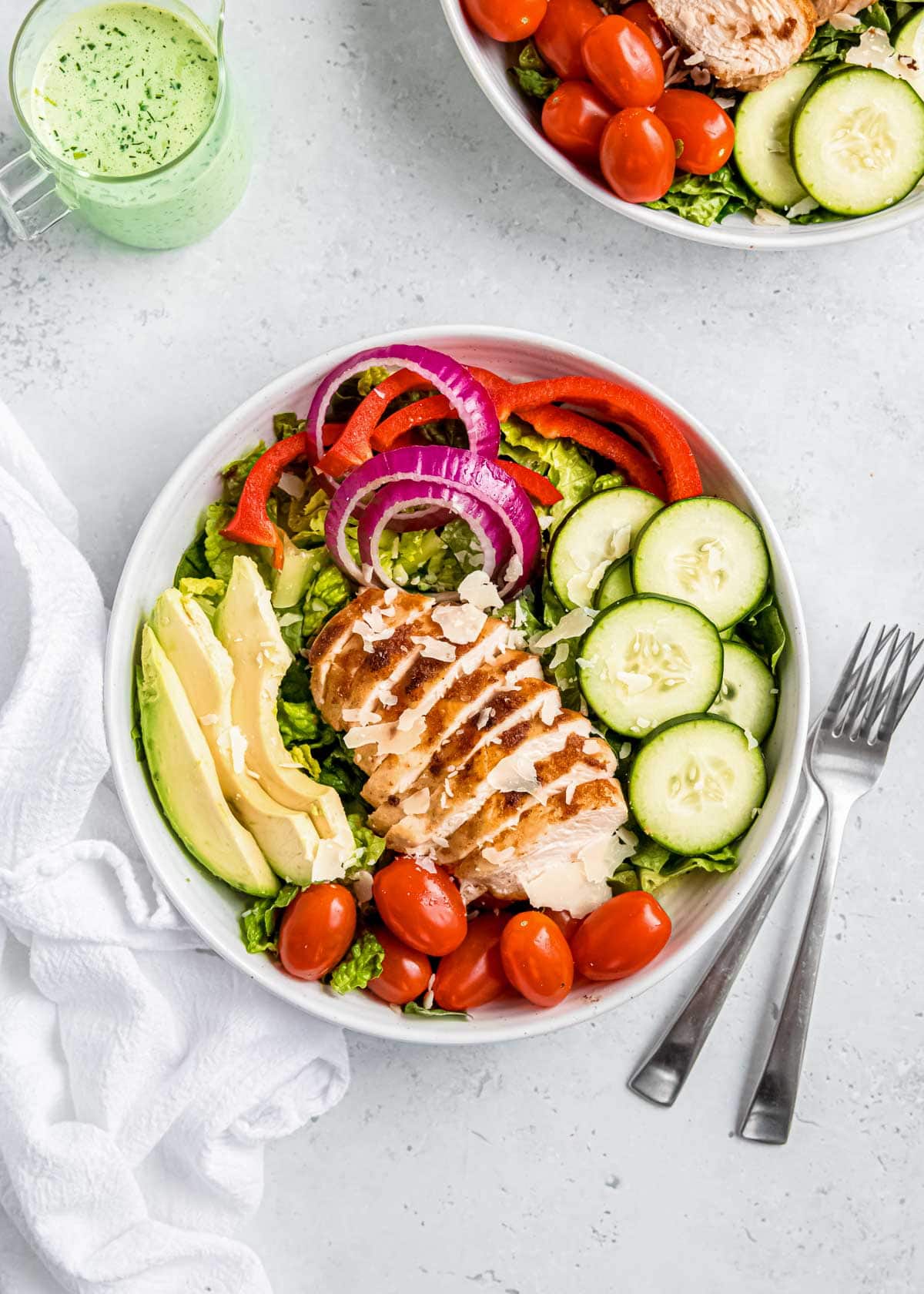 overhead image of green goddess chicken salad and fork on white table