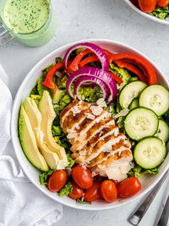 overhead image of green goddess salad on white plate