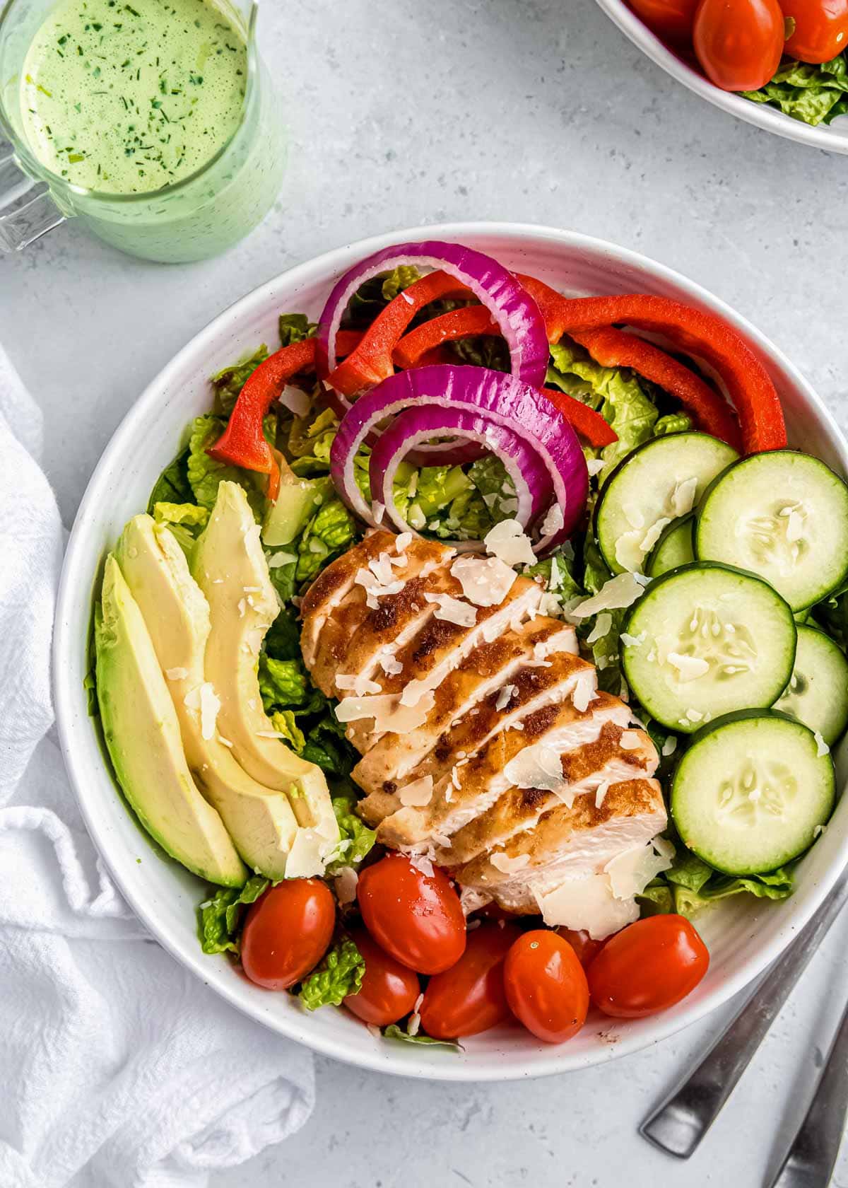 overhead image of green goddess salad on white plate