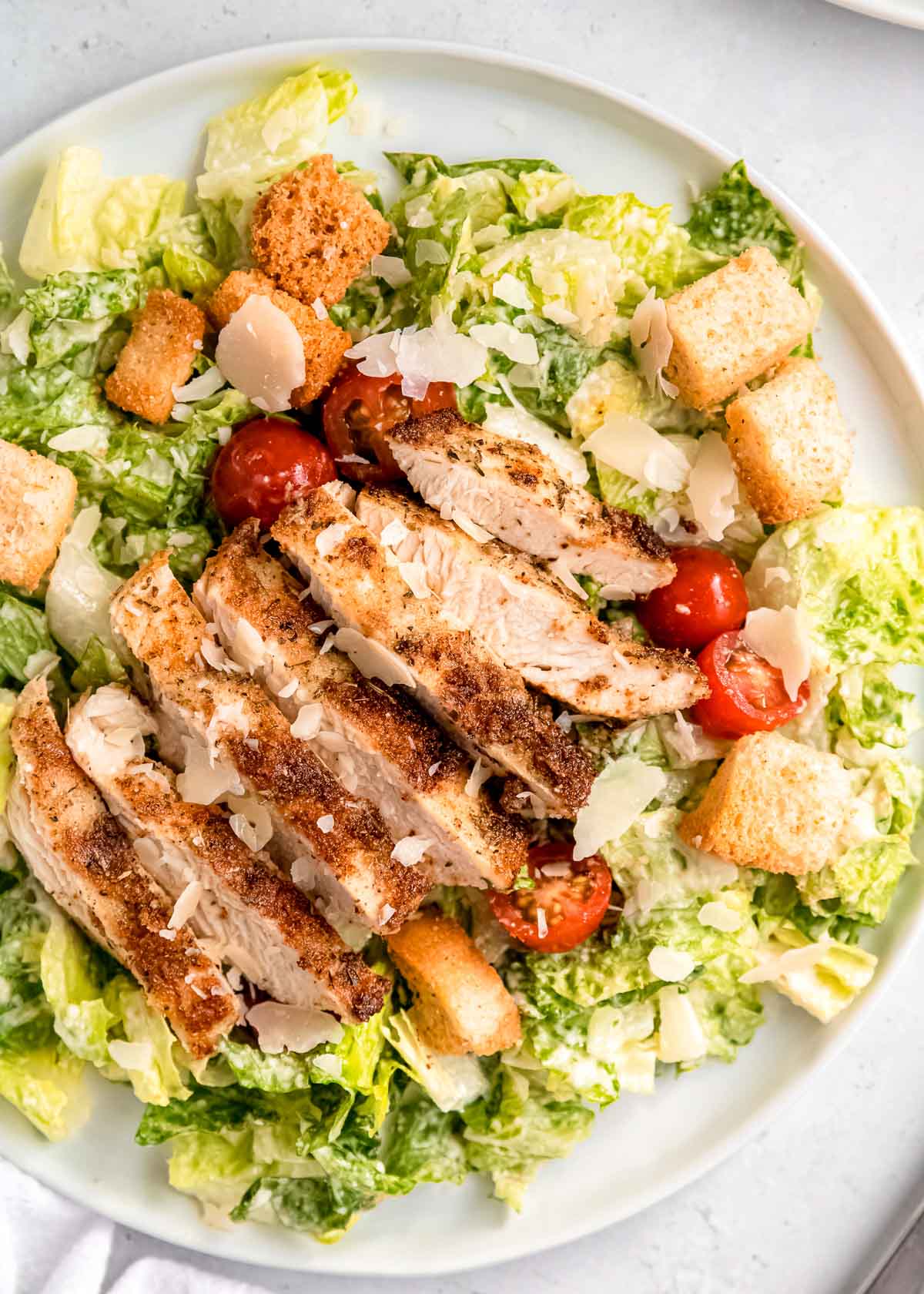 overhead, close up image of grilled chicken caesar salad