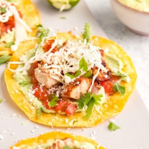 close up image of a grilled chicken taco on white background