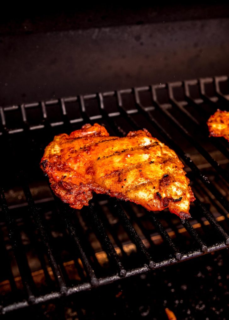 chicken being grilled on grill