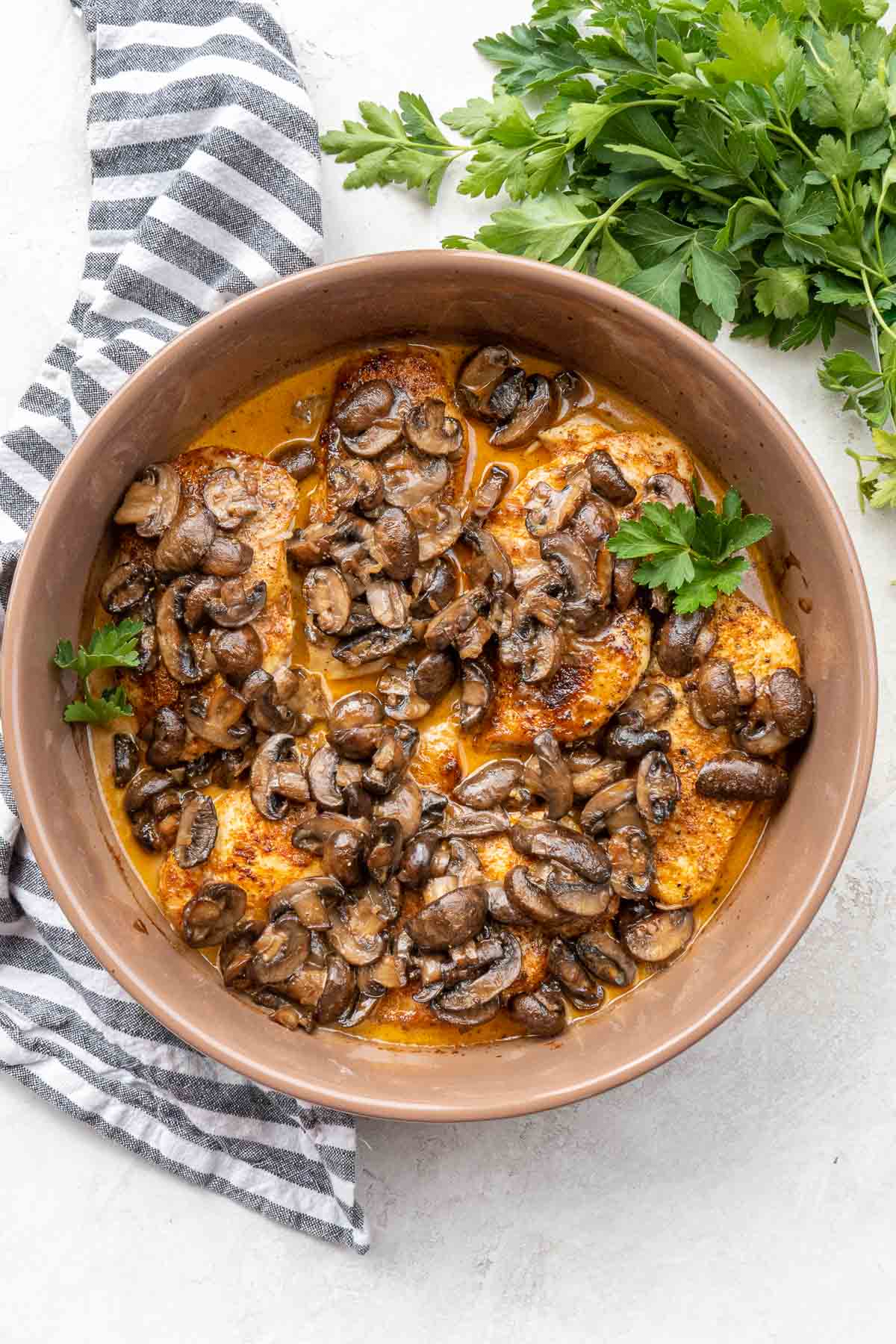 overhead image of baked mushroom chicken in bowl