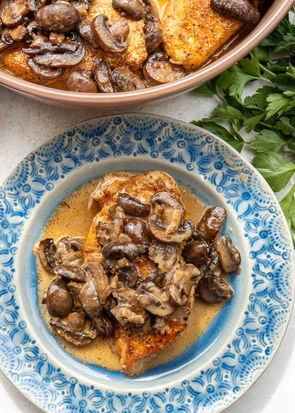 baked mushroom chicken in a blue bowl