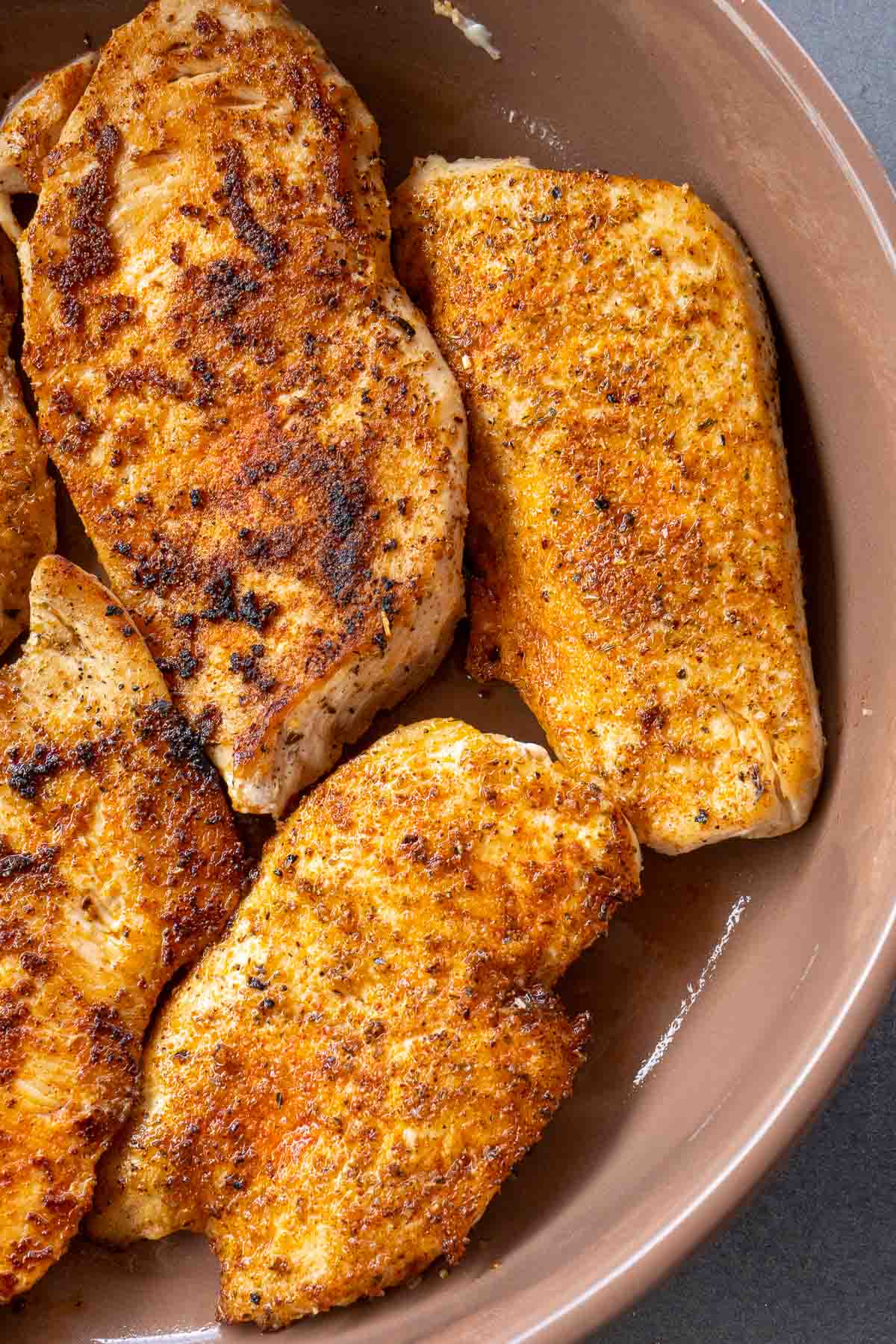 overhead image of baked chicken in bowl