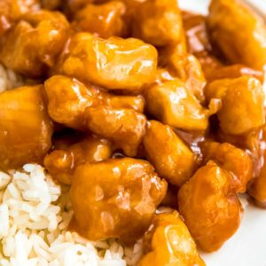 close up image of orange chicken and rice