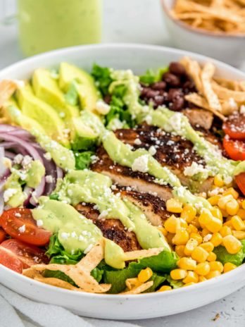 close up image of southwest chicken salad in white bowl