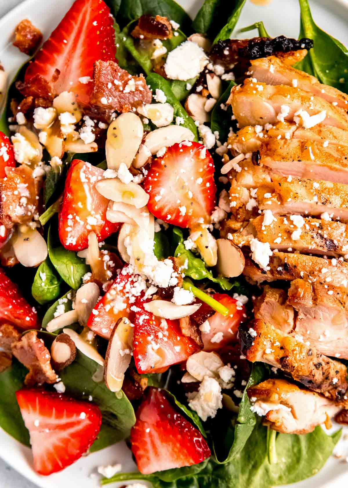 close up image of strawberry spinach chicken salad