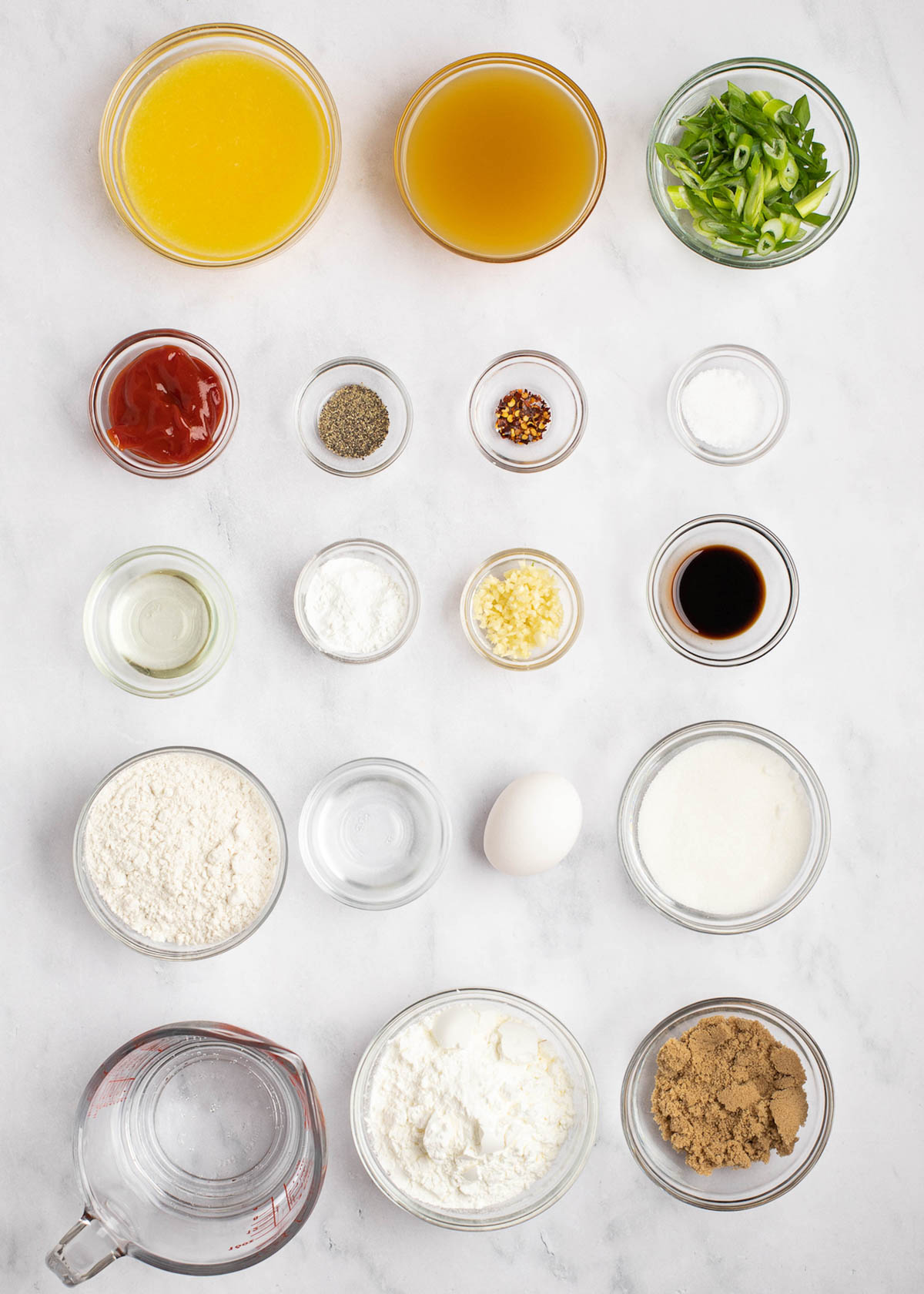 sweet and sour chicken ingredients on white table 