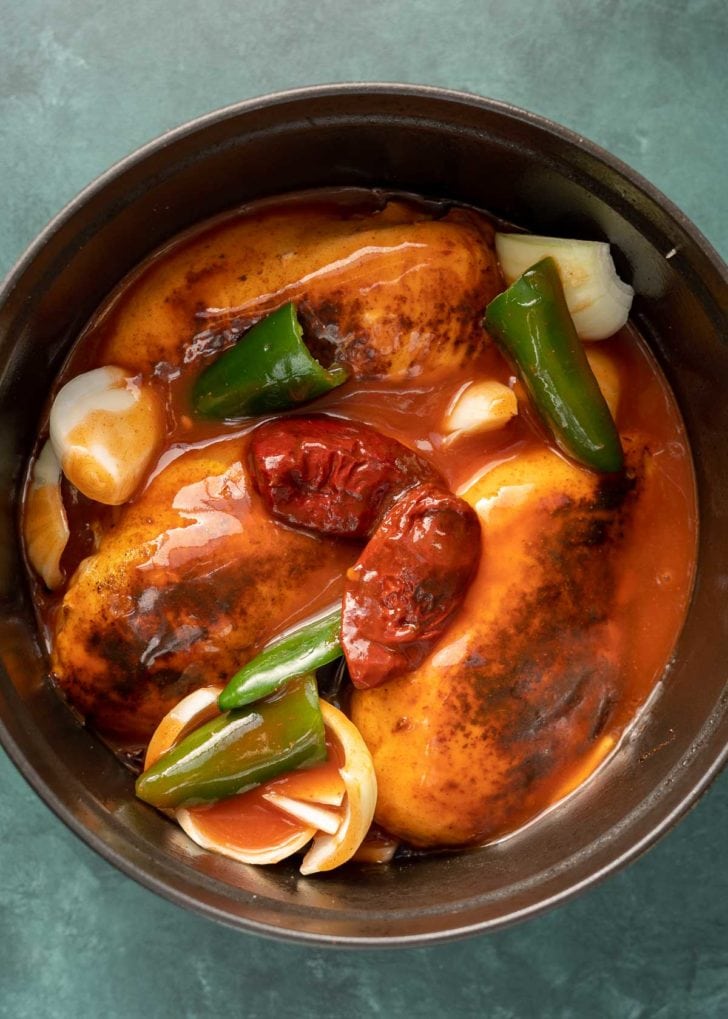 peppers, onion, and chicken in dutch oven