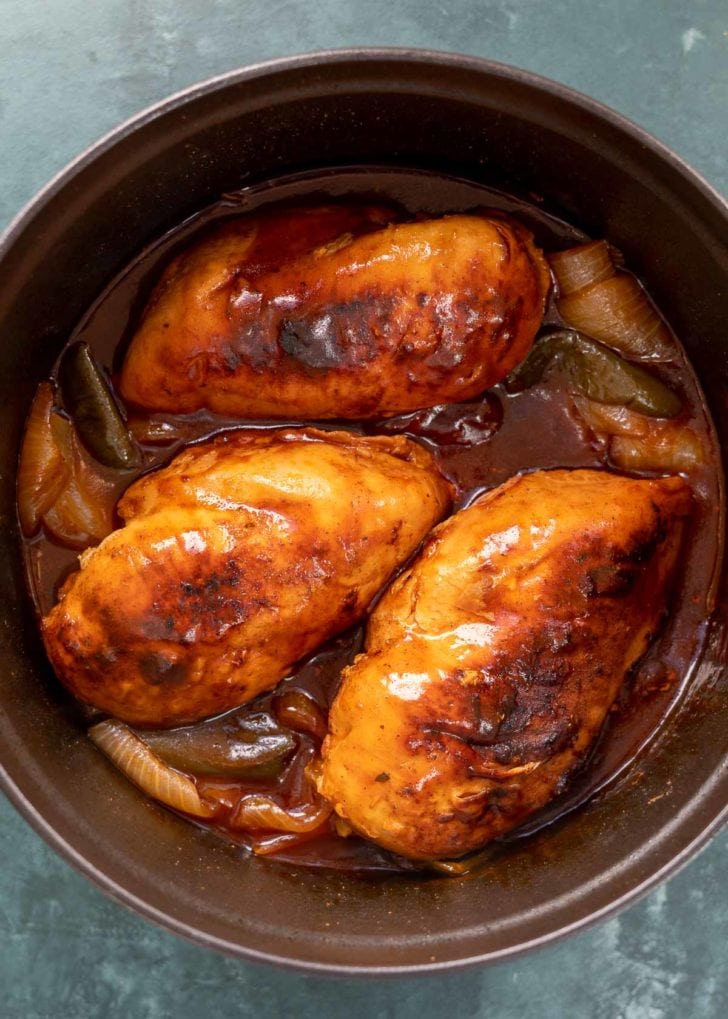 cooked chicken and peppers in dutch oven