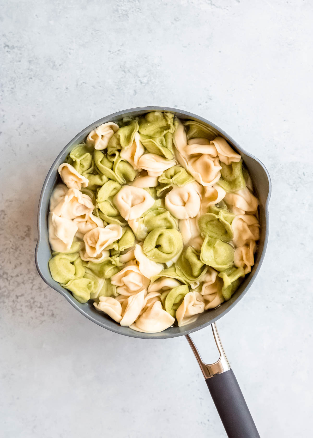 tortellini in a gray pot