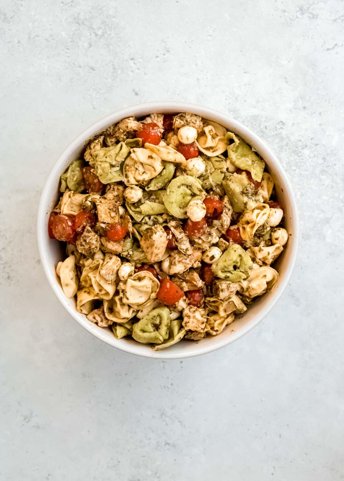 tortellini pasta salad in white bowl