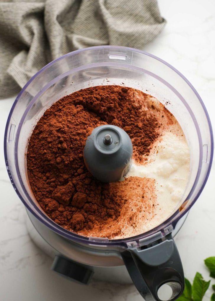 sweetened condensed milk, half and half, heavy cream, dutch processed cocoa powder, and extracts in a food processor to make ice cream