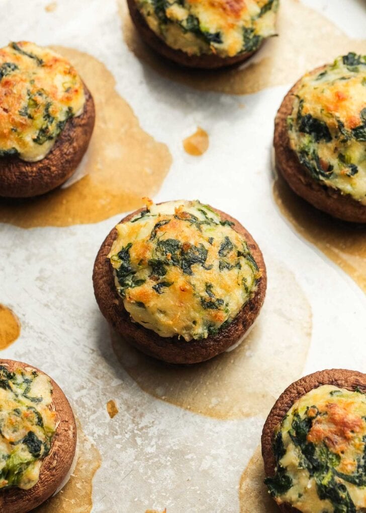 up-close view of crab and bacon stuffed mushrooms with cheese