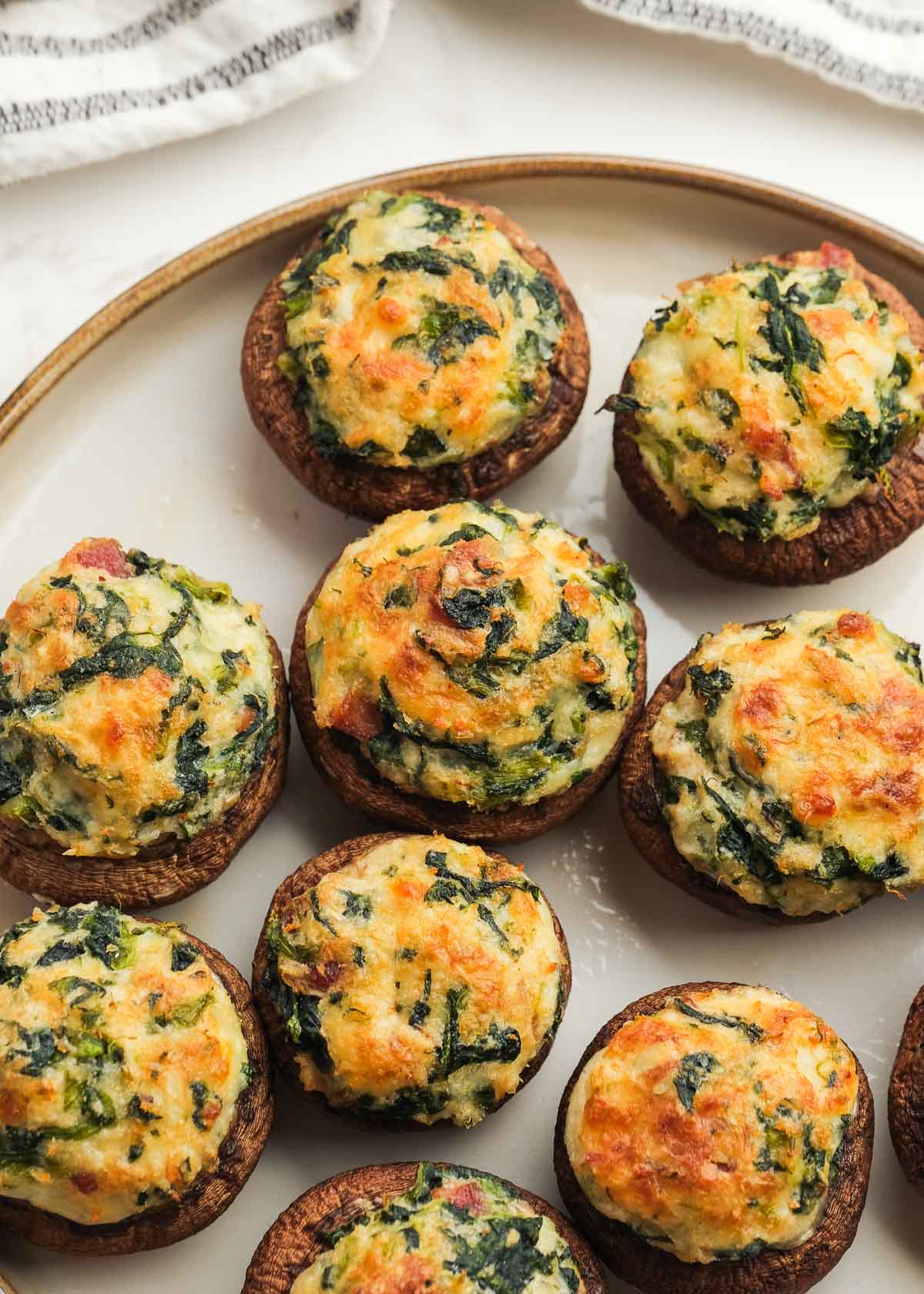 crab and bacon stuffed mushrooms on a plate