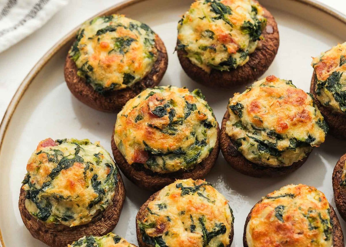 horizontal image showing a closeup view of the cheesy crab stuffed mushrooms