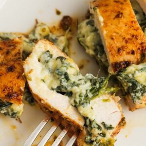 a closeup shot of spinach and cheese stuffed chicken