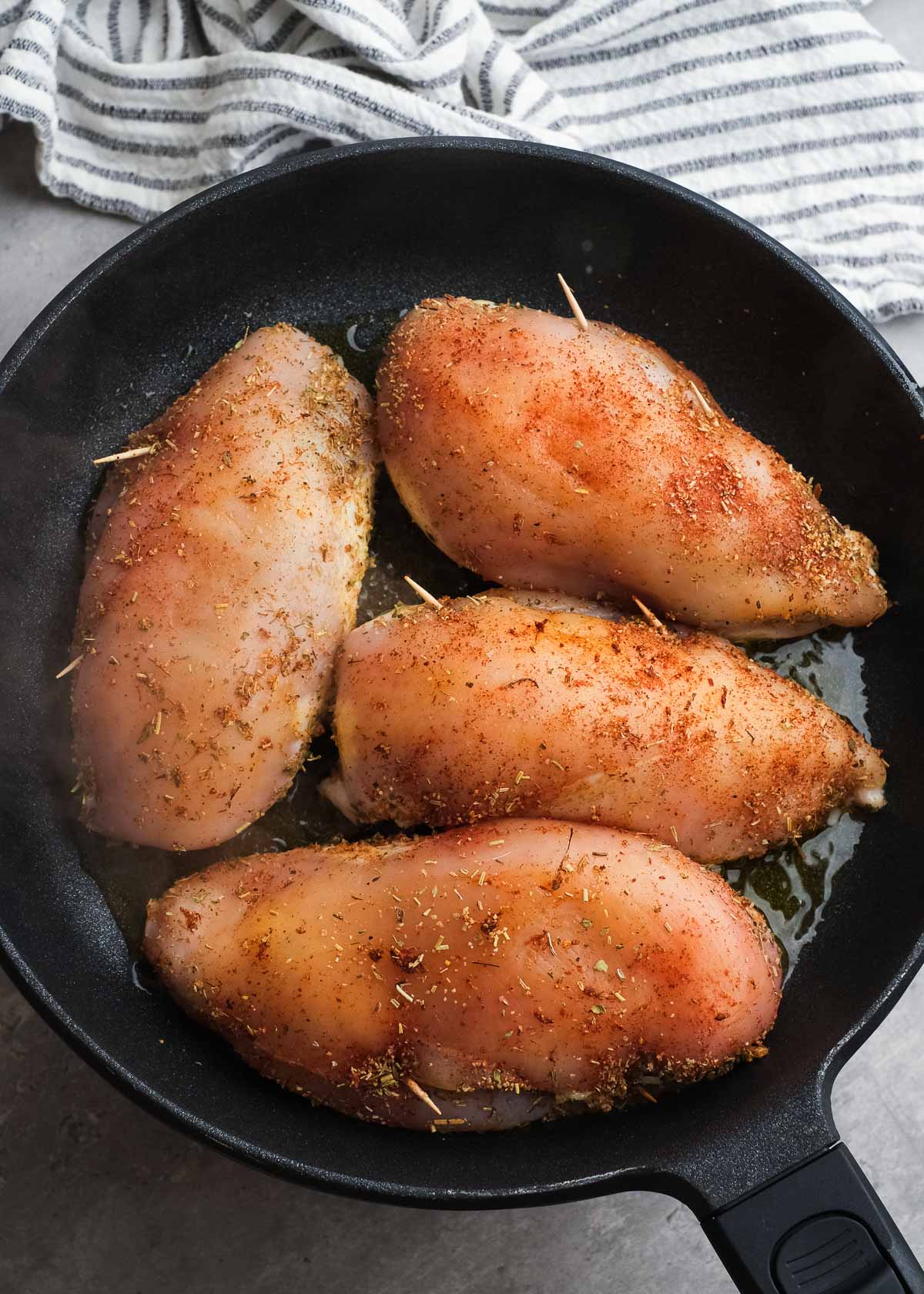 seasoned chicken breast in a skillet