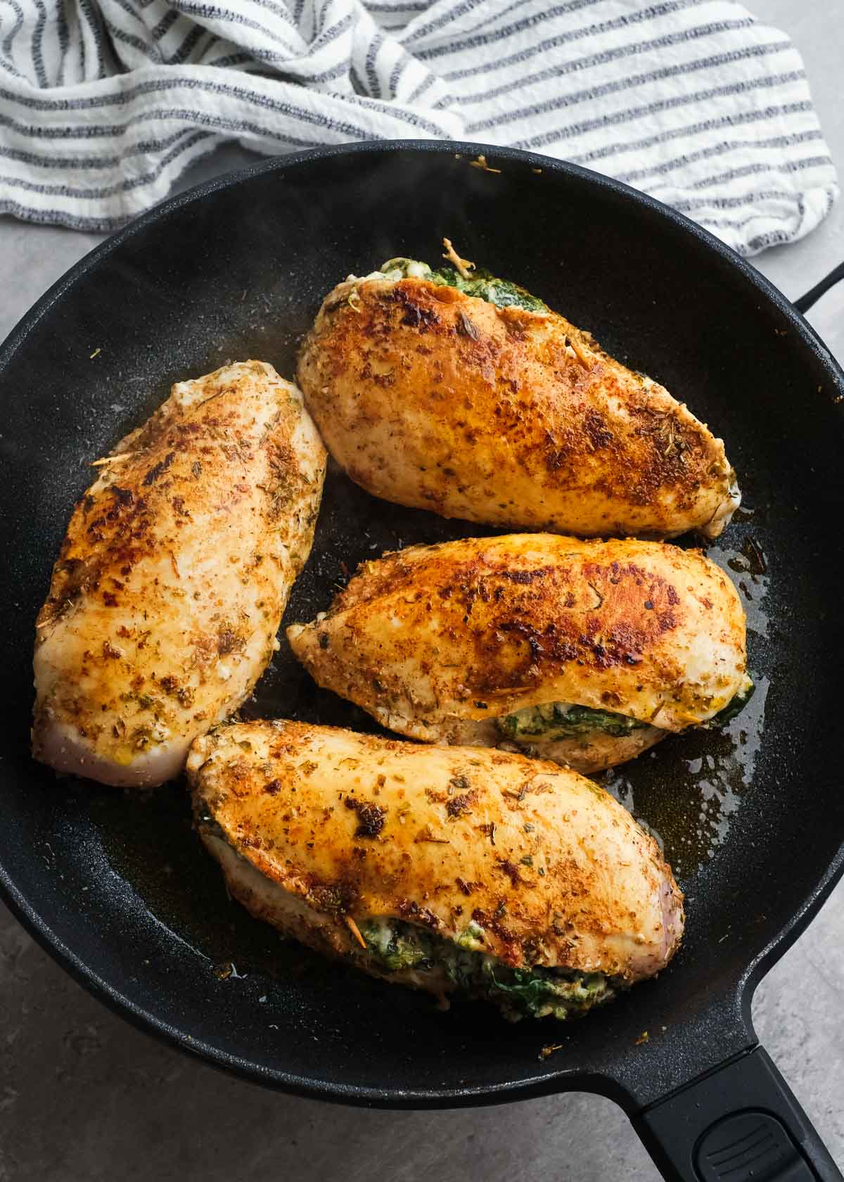 cooked and seasoned chicken in a skillet