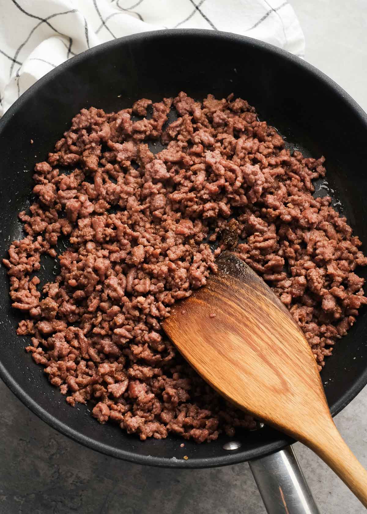 ground beef cooked in a skillet to mix with garlic powder, Worcestershire sauce, salt, and pepper for big mac wraps