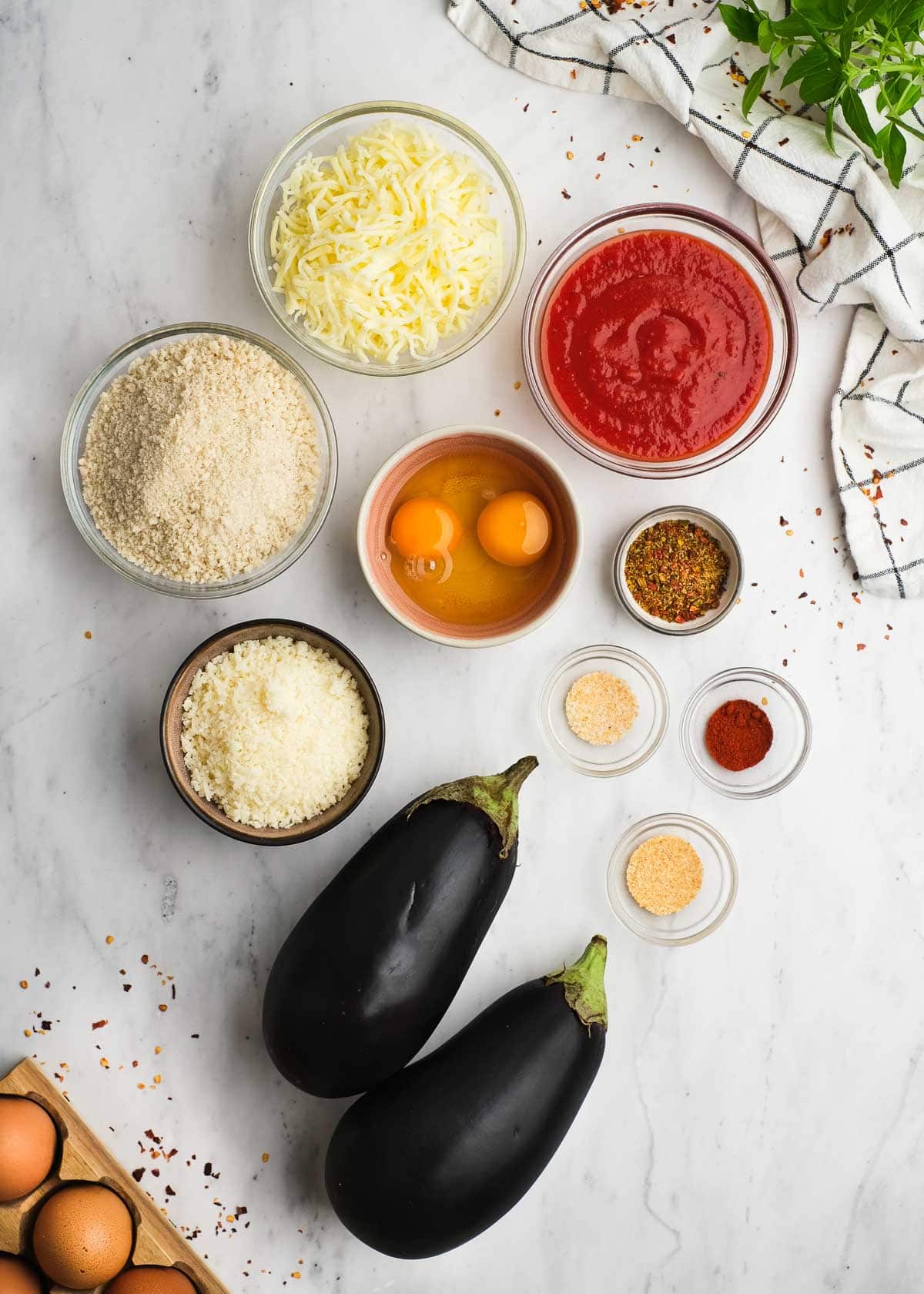 all ingredients needed for crispy eggplant bites on a marble countertop