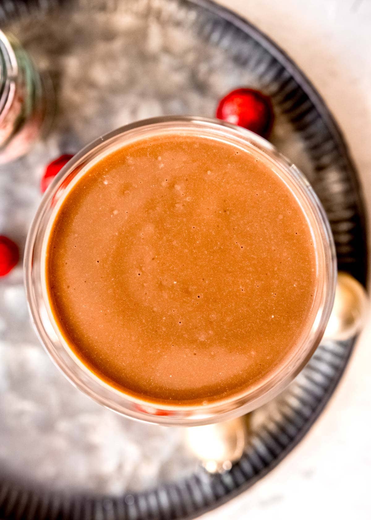 overhead shot showing creamy peppermint mocha protein shake in a glass