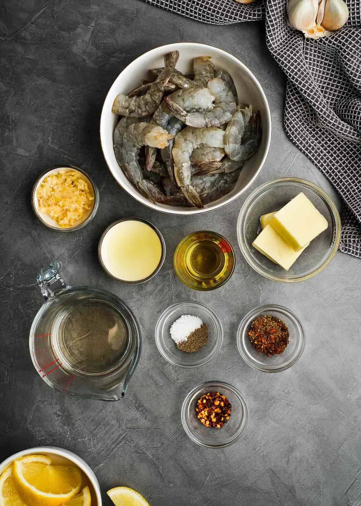 all ingredients needed for an easy shrimp scampi recipe on a gray countertop