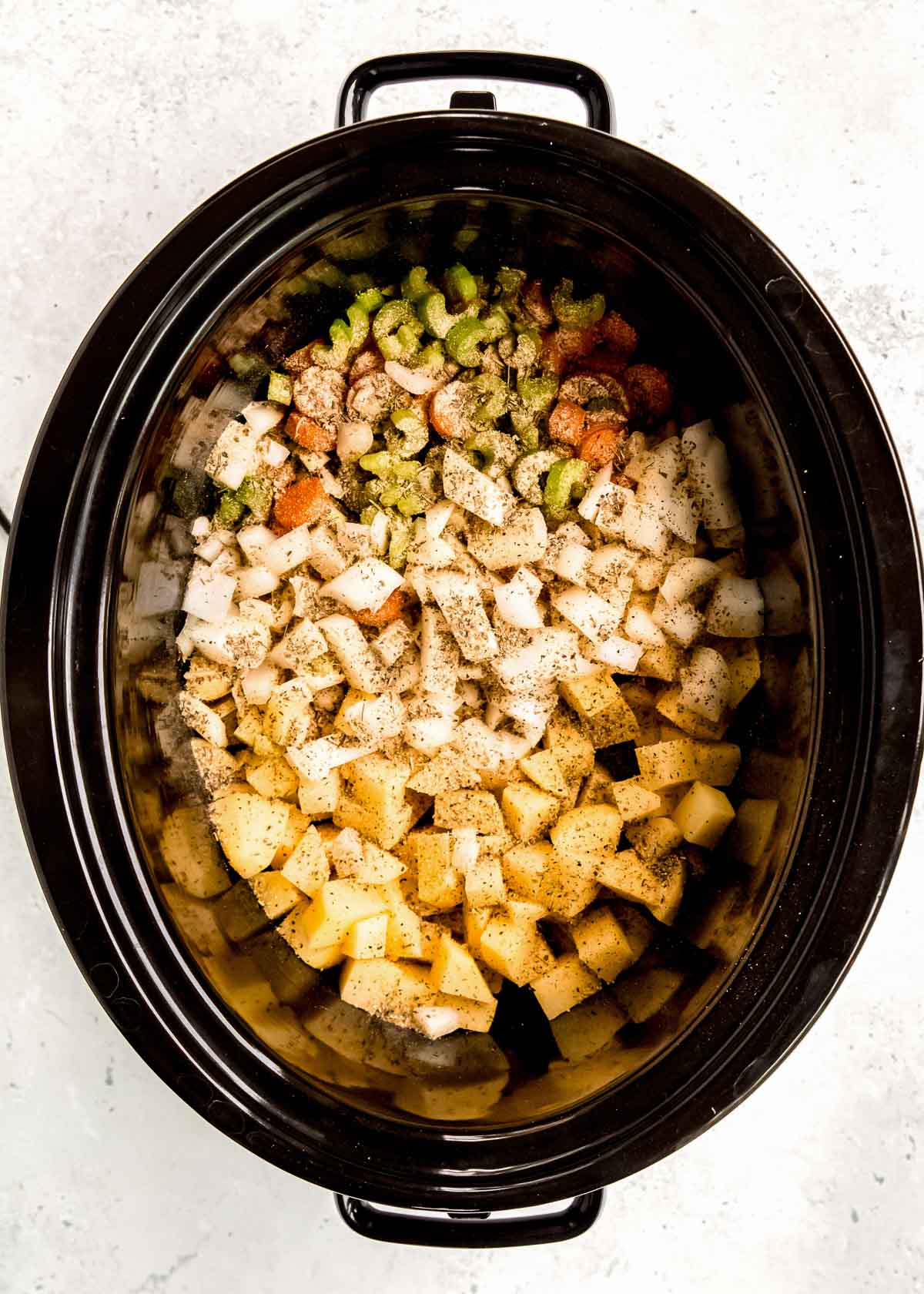 vegetables in a slow cooker for potato soup