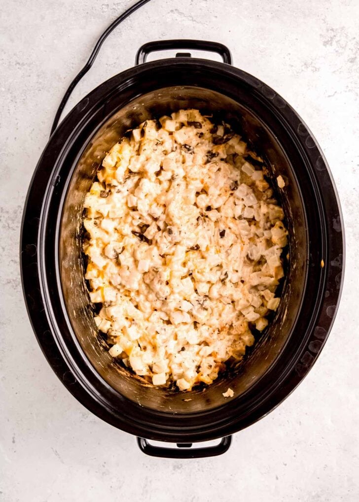 frozen potatoes mixed with cream of soup in slow cooker