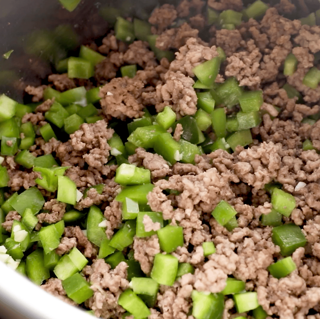 ground beef and peppers cooking in instant pot