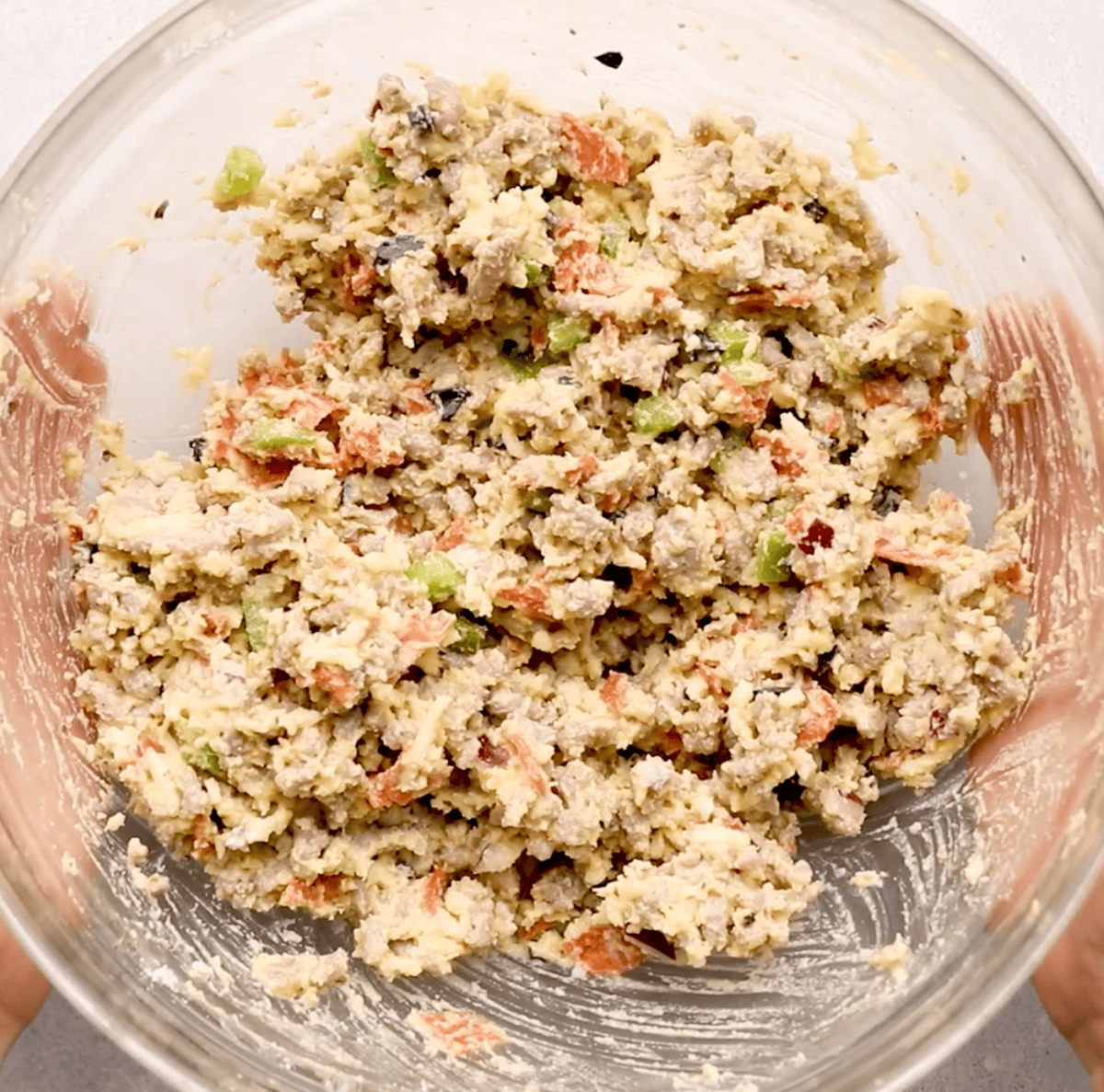 supreme pizza puff ingredients mixed in mixing bowl