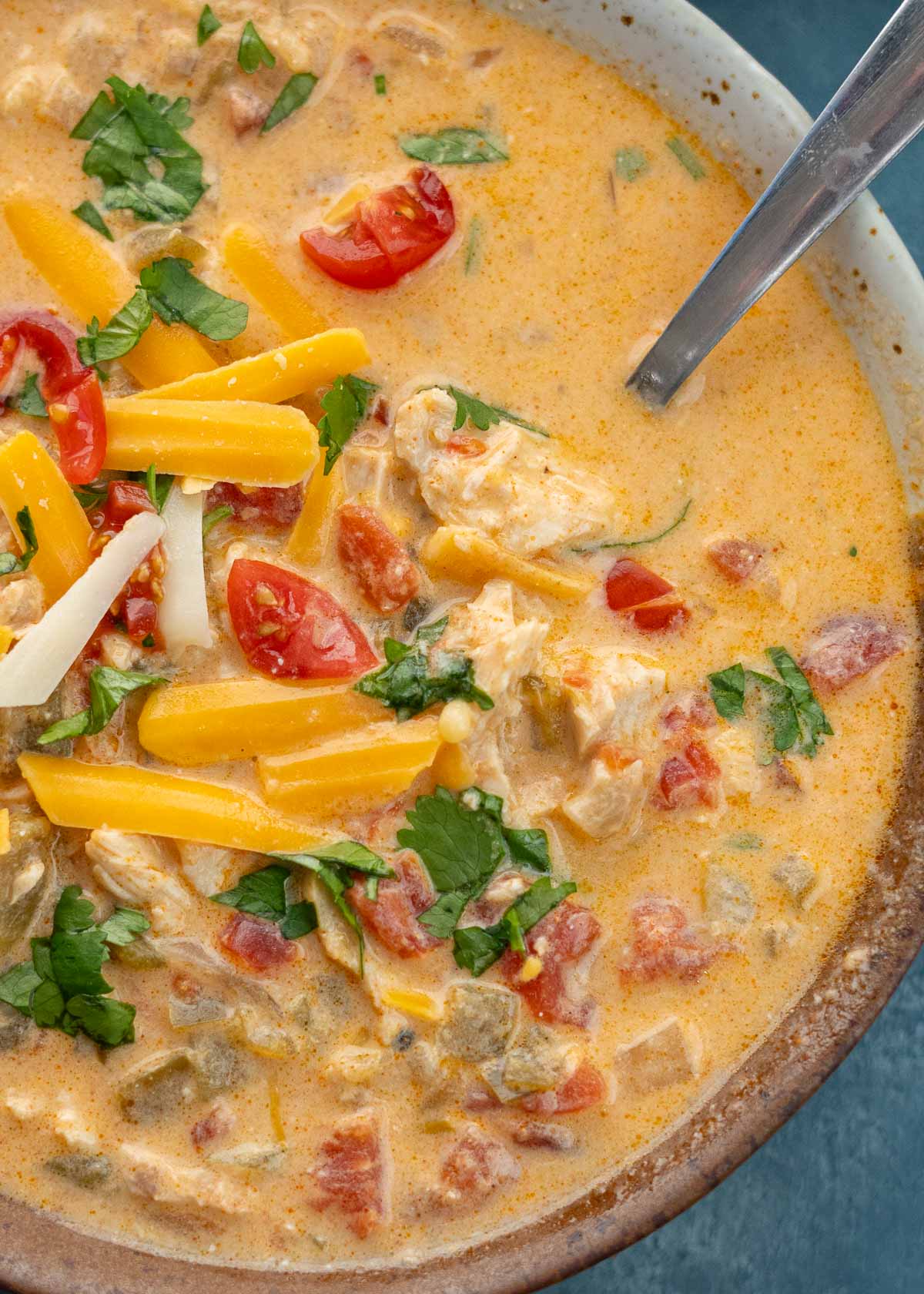 a closeup shot of cheesy chicken enchilada soup