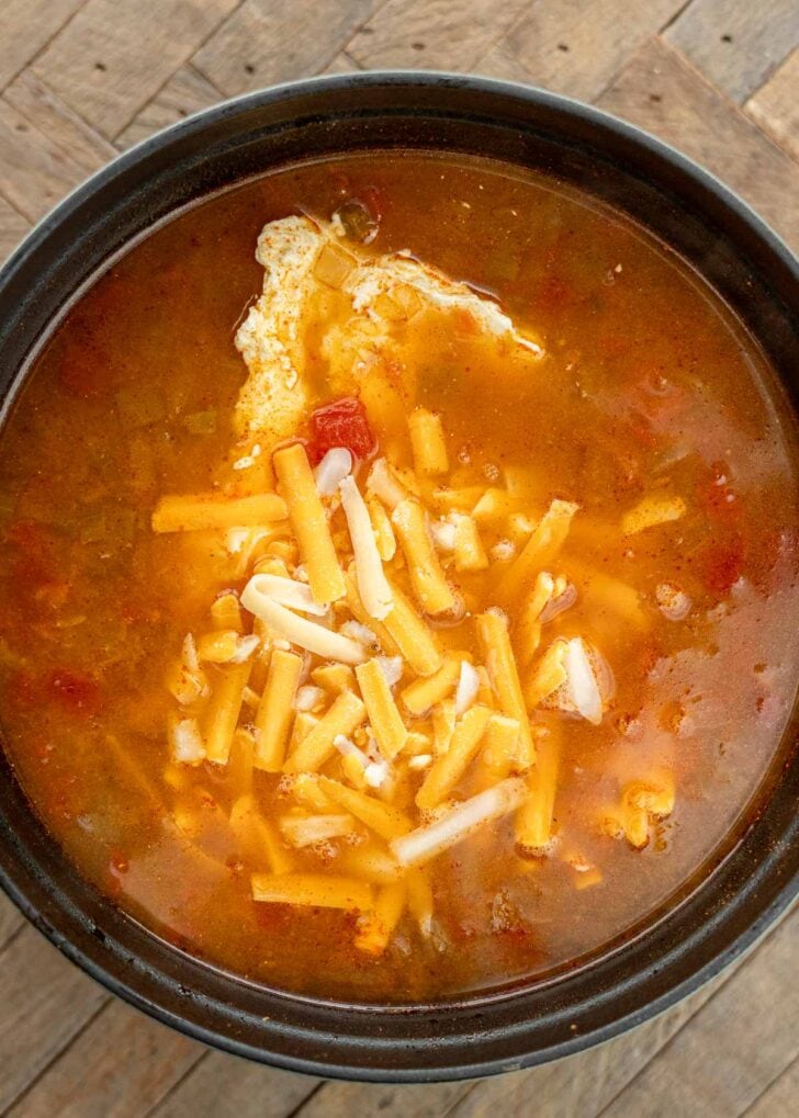 cream cheese and shredded cheese in soup