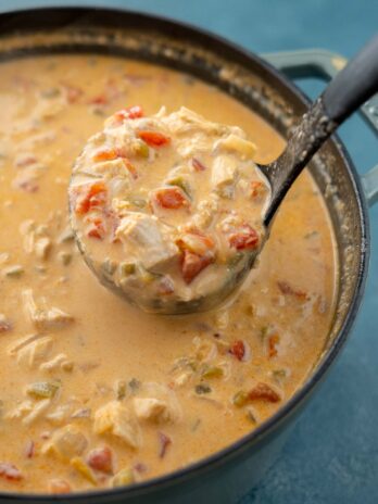 a ladle full of cheesy chicken enchilada soup